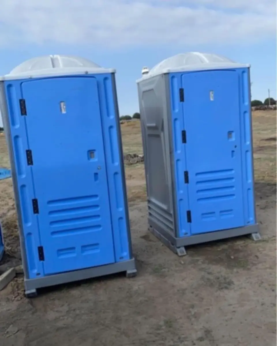 Porta potties on a dirt job site
