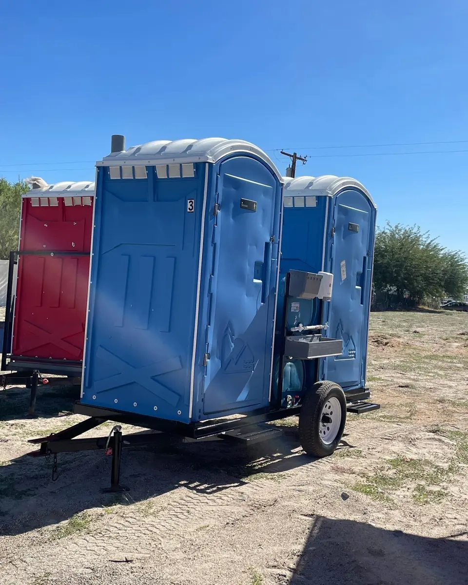 Porta potties secured on a trailer for delivery