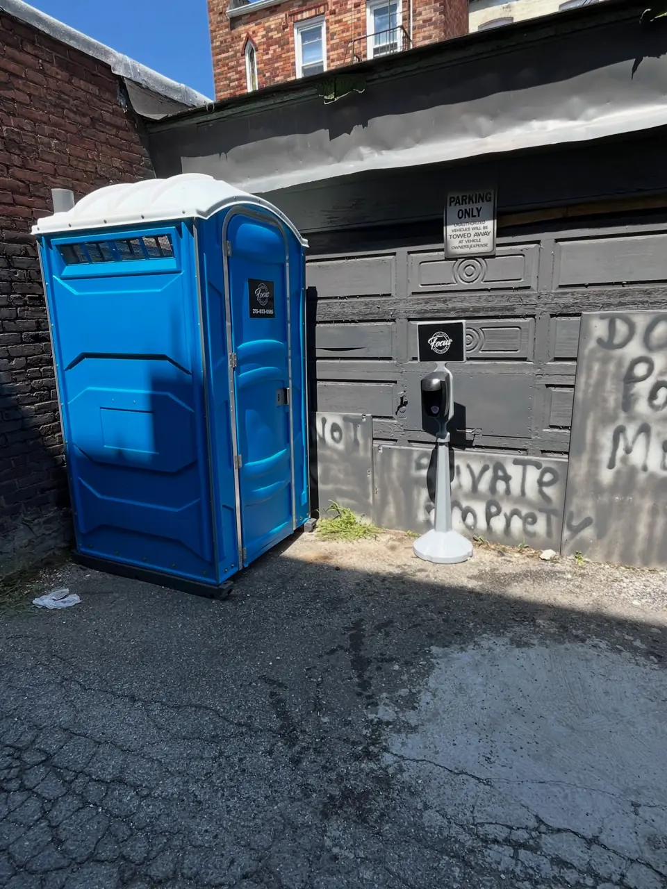 Porta potty placed on a residential drive